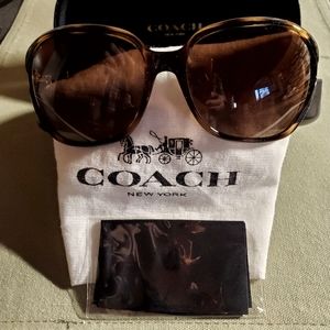 Brand new, never worn Coach sunglasses.